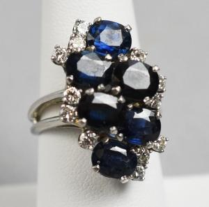 Beautiful 14kt gold, sapphire and diamond ring with six deep blue sapphires (est. $5,000-$10,000).