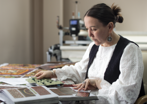  Artisan Gulmira Ualikhan designs traditionally-themed fashion and patchwork fashions and decor in Kazakhstan. Photo courtesy ITC.