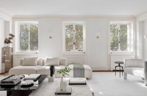 Views of Central Park trees from the posh living room of the Maisonette at 953 Fifth Avenue designed by Interior Marketing Group