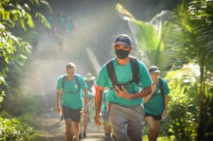 Participants walking through the jungle in Tabanan, back in 2021's MMM.