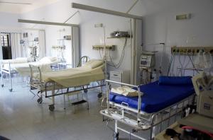 A room with hospital beds that are used for patients.