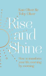 The cover of the book Rise and Shine - How to transform your life, morning by morning features a bronze sun motif and white lettering against a sky-blue background