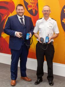 Two men pictured inside London Fire Brigade's HQ in Union Street, London in February 2023. At left is Dave Turner, Tait Communications' Managing Director Europe, Middle East and Africa. With him is London Fire Brigade Group Commander Patrick Tawney. Each