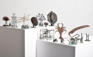 A collection of small, intricate metal sculptures.