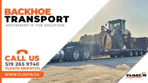 Transport truck is hauling a Backhoe