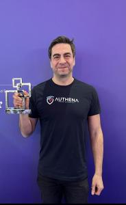 Matteo Panzavolta, Authena CEO, holding the 2023 GLOMO Award for  Best Mobile Innovation for Web3 category