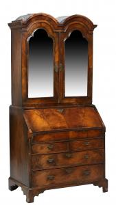 19th century English Queen Anne walnut secretary bookcase, 84 inches tall by 40 inches wide, the double bonnet top above arched beveled mirrored panel doors (est. $1,000-$2,000).