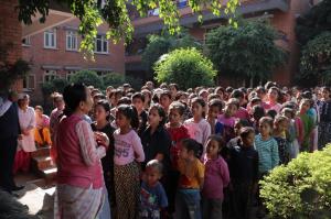 Founder and chairperson of Maiti Nepal, Anuradha Koirala (left in pink top) speaks to children in Nepal.