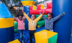 Kids having fun at the bouncy house at Castle Kyalami.