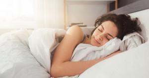 woman getting a good nights sleep with Delta 8 and Delta 9 sleep gummies