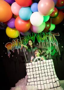 Guests enjoying the hot air balloon art piece at Rainbow Vomit