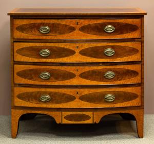 Fine Federal satinwood and mahogany bow-front chest of drawers, Saco, Maine, 1812 – est. $10,000-$15,000.