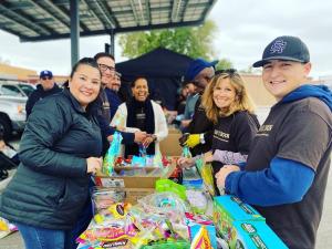 Volunteers prepare Springtime treat bags for young attendees