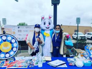 Mr. Bunny poses with vendors at the 2022 Spring Community Health and Wellness Event
