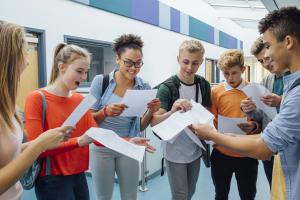 A group of friends celebrating exam success