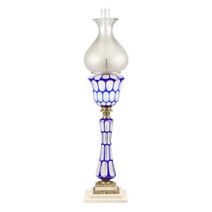 Cobalt double overlay kerosene stand lamp, made in America circa 1860-1880, overall 27 inches tall, blue cut to white cut to colorless urn-shaped front, maker unknown (est. CA$9,000-$12,000)