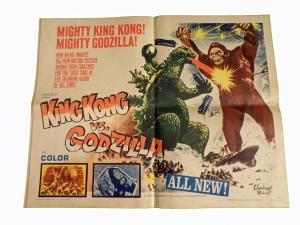 Half-sheet poster for King Kong vs. Godzilla (Universal, 1963), depicting the two monsters engaged in battle, measures 22 inches by 28 inches.