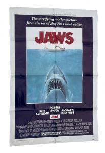 One-sheet poster for JAWS (Universal, 1975), directed by Steven Spielberg, with Roy Scheider, Robert Shaw and Richard Dreyfuss, visually arresting, with shark graphic.