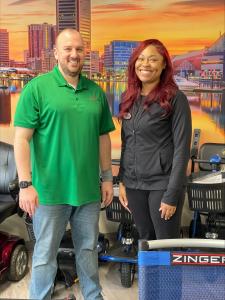 Owner Michael Beckman with Melody in the Mobility City showroom located at 6020 Meadowridge Center Dr, Ste P2, Elkridge, MD 21075