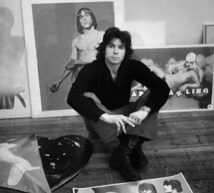 Portrait of Richard Bernstein sitting surrounded by his art in his Chelsea Hotel Studio c. 1971