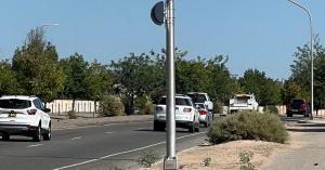 Albuquerque road with NovoaGlobal speed photo enforcement system on a pole monitoring speeding.