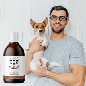 Man holding dog with Dog-Ease CB2 oil