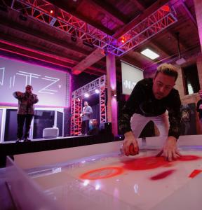 Ty Nitz Creating Live Art at His Solo Art Exhibition at Cine City Studios with Musician Lester Ray and Rob Threezy