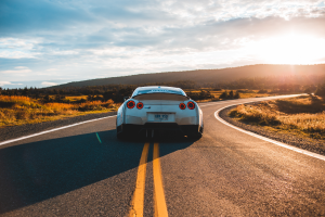 A car driving down a highway, which could be covered by CarGuard Administration