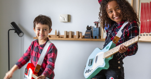 Loog 3-string and 6-string guitars played by kids