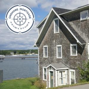 Westport, MA waterfront home located in rural area of Massachusetts with Onshore Mortgage, LLC. logo on top left of photo.