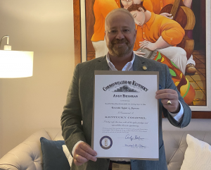 The Honorable Dr. Rafael Marrero displays his Kentucky Colonel proclamation 