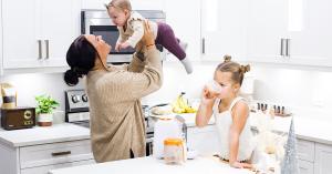 Family in kitchen with Quark Quook Baby Food Maker