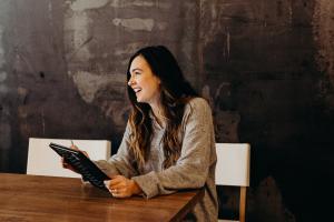 Woman working on CA data reporting on tablet