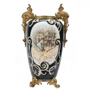 Dark green footed vase showing the Wave Crest banner mark, 17 inches tall, with classic courting scene décor and incredible gilt metal fitted handles and feet (est. $1,000-$1,750).