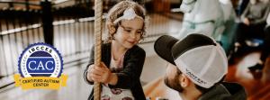 father and daughter on carousel in the Willamette Valley