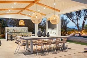 Outdoor living space Casa Roca - designed by Paula Oblen of Hotelements - Photo by Austyn Moreno, Aim Media Group.