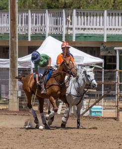 two women arena polo players during a competition in California