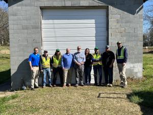 Door Systems and West Stanley pose in front of newly installed garage door