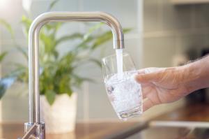 Fluoridated Water from Faucet Filling Clear Glass