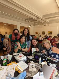 May, Amy, and Jen having fun with crafters during Altenew's 2022 Meet and Greet