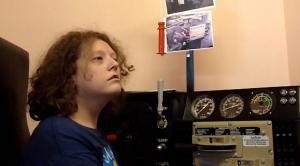 patron enjoying train replica at City of benson Visitor Center