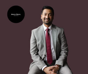 Dr. Jagan Kansal wearing a grey suite sitting in a chair and smiling