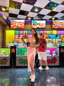 Girl shows off a Pot Passport at Wonderland Cannabis store Bangkok