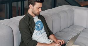 A Business Professional Wearing a Stirling Tshirt