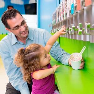 dad and young daughter in the toppings bar at Turkey Hill Experience