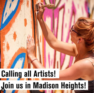 Woman painting colorful mural