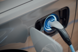 An electric vehicle charges, which Elijah Norton’s company can cover with a vehicle protection plan