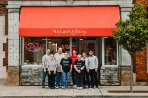 Group Photo Caption: (L to R): Kyle Simmons (Proprietor), Cathy Brown (co-founder), John Esh (Baker), Barbara Esh (Baker), Alexandria Wein (Baker), Becky Gluck (Baker), Ashley Steiner (Cashier), Grant Smucker (Proprietor), (Not pictured: Ashley Luginbuhl,