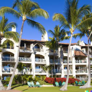 Photo of timeshare resort in California or Hawaii or Nevada with sunshine and palm trees.