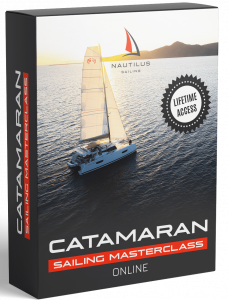 Catamaran sailing on the ocean as the sunsets